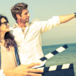 actor pointing out at sea