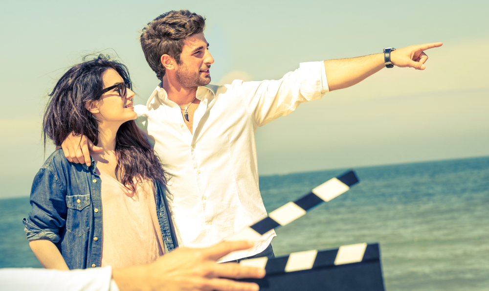 actor pointing out at sea