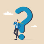 Man leaning on a question mark.