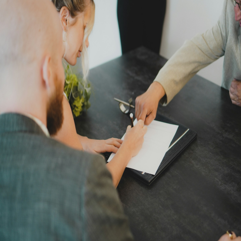 people signing a contract