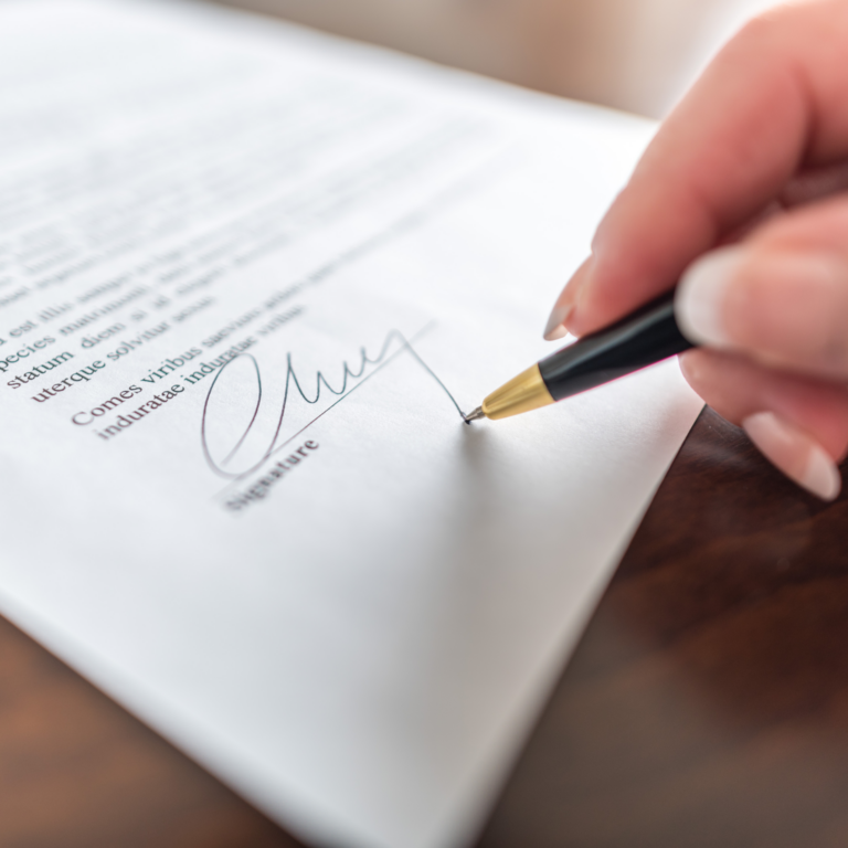 person signing their signature on a Delaware Certificate of Formation